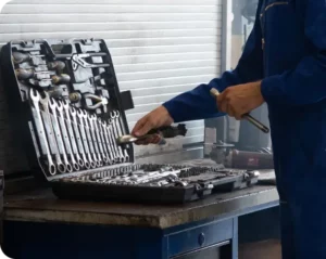 mechanic putting away tools